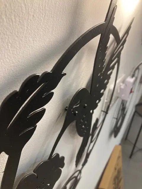 Metal Wall Decor Of A Hummingbird Hovering Above An Open Flower.jpg